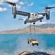 An MV-22B Osprey lifts a high mobility multipurpose wheeled vehicle from USNS Sacagawea (T-AKE-2) during exercise Freedom Banner 2013 (US Marine Corps)